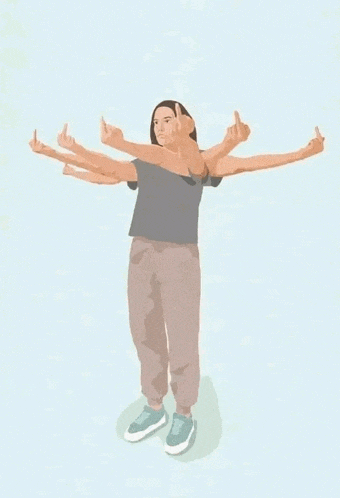 a woman is standing with her arms outstretched and giving a middle finger .