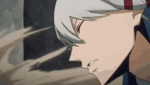 a close up of a person 's face in a anime with a hat on .