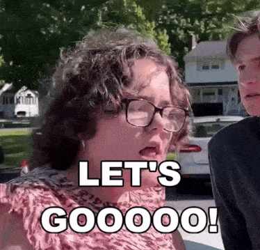 a woman with glasses says let 's goooo