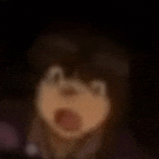 a blurry picture of a person with their mouth open .