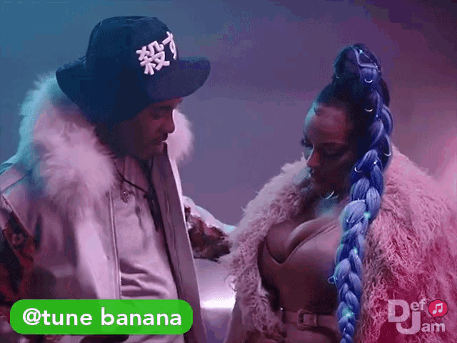 a man and a woman are standing next to each other and a green sticker that says tune banana