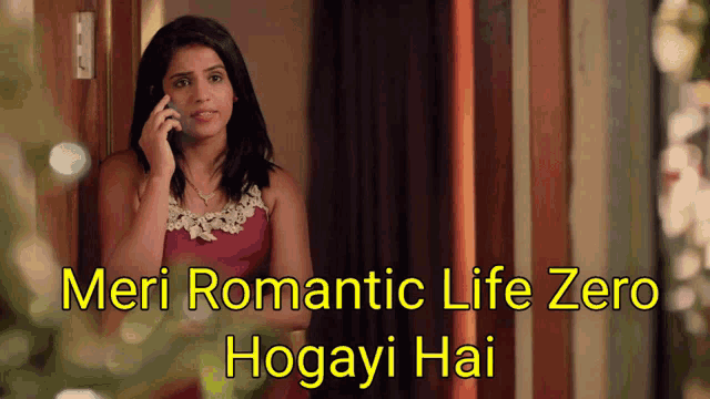 a woman in a pink dress talking on a cell phone with the words meri romantic life zero hogayi hai below her