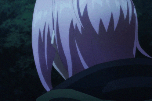 a close up of a person 's hair with purple highlights