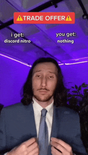 a man in a suit and tie is making a funny face