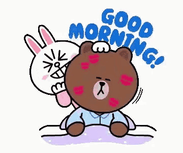a brown bear and a white rabbit are sitting on a bed . the rabbit is kissing the bear on the forehead .