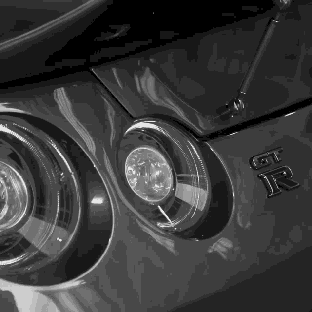 a black and white photo of a nissan gtr