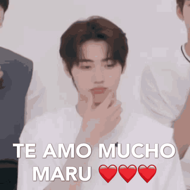 a man in a white shirt is holding his hand to his chin and says te amo mucho maru