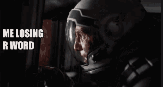 a man in a helmet says " me losing r word " in a black and white photo