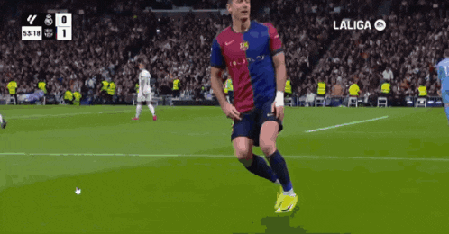 a soccer player celebrates a goal during a laliga match