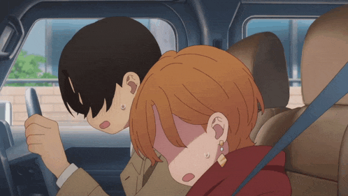 a man driving a car with a woman sleeping in the back