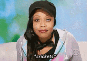 a woman wearing a hat and a bow tie says " crickets "