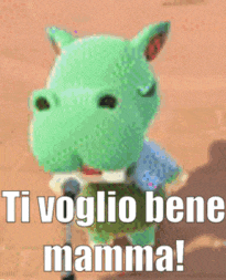 a green stuffed animal with the words `` ti voglio bene mamma '' written on it