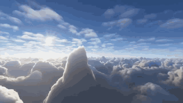 the sun shines brightly through the clouds above a mountain