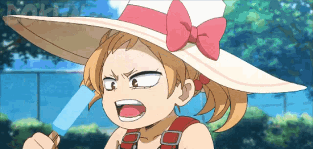 a girl wearing a hat and overalls is eating an ice cream