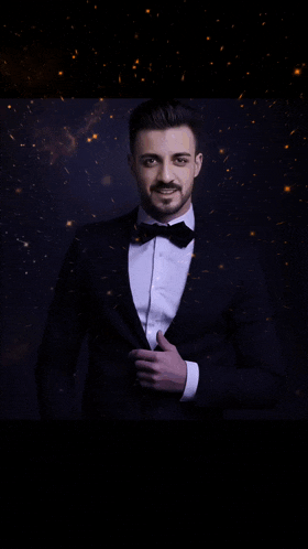 a man in a tuxedo and bow tie with the name s2g cava on the bottom