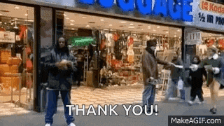 a group of people are standing in front of a store and saying thank you
