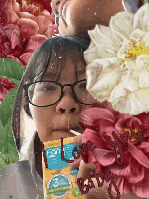a girl with glasses is drinking from a box that says fan