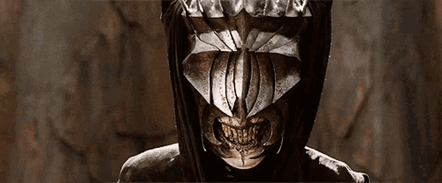 a close up of a person 's face with a helmet on it