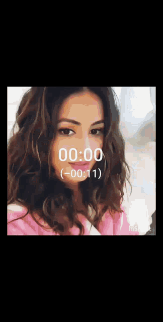 a woman 's face is shown with a countdown of 00:00