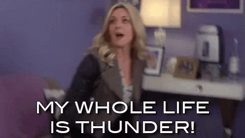 a woman is sitting on a couch with her mouth open and says `` my whole life is thunder ! ''