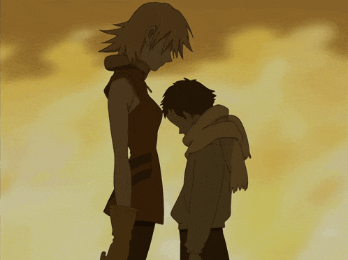 a man and a woman are standing next to each other and the woman is taller than the man