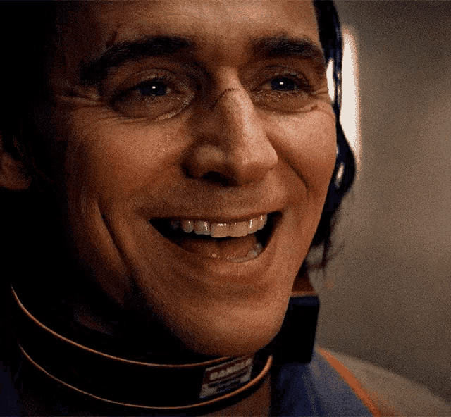 a close up of a man 's face with a choker that says danger