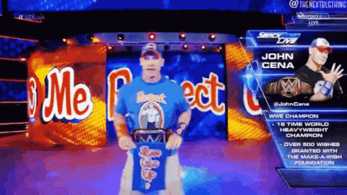 a man in a blue shirt is standing in front of a sign that says john cena on it