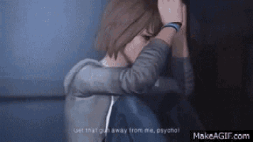 a girl in a video game is talking to a man and holding her head .