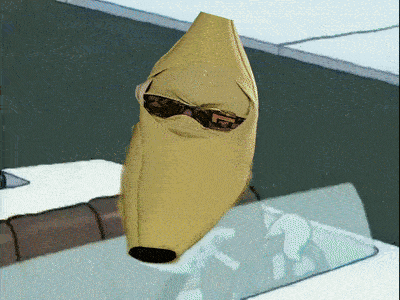 a banana wearing sunglasses is sitting on a table
