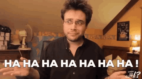 a man with glasses is laughing and says ha ha ha ha ha ha