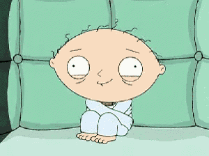 a cartoon character is sitting on a couch with his legs crossed