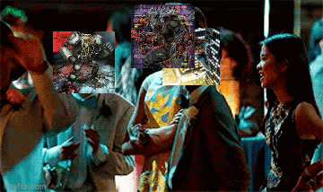 a group of people are dancing in a dark room with a picture of a robot in the background .
