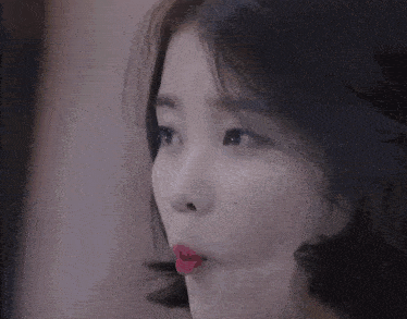 a close up of a woman with red lipstick on her lips