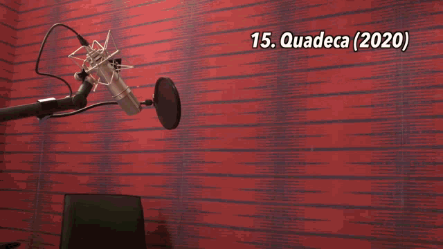 a man stands in front of a microphone with the words 15. quadeca ( 2020 ) on the top