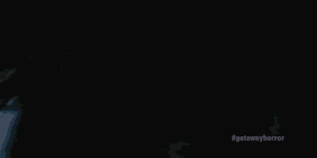 a dark background with the hashtag getawayhorror