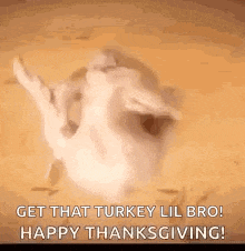 a turkey is laying on its back on a table .