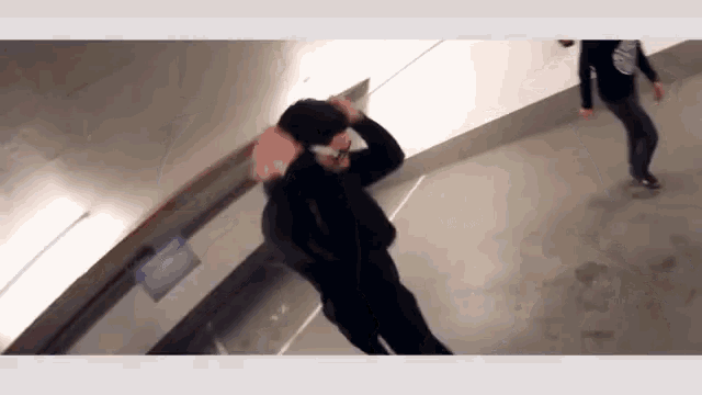 a blurred image of a person standing in a tunnel