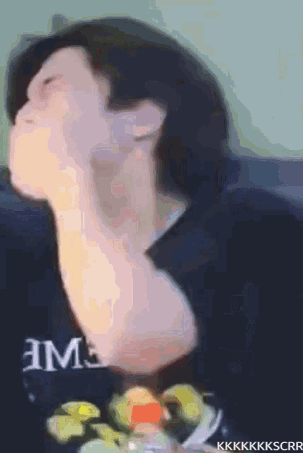 a blurry picture of a person wearing a shirt that says ' hms ' on it