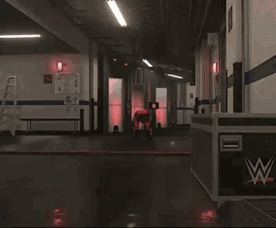 a man in a red wrestling outfit is standing in a hallway .