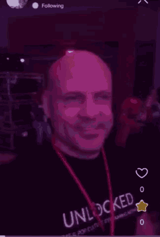 a man wearing a shirt that says unlocked on it