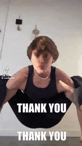 a man in a black tank top is doing a yoga pose with the words thank you thank you written below him