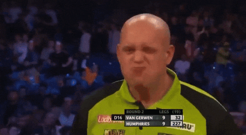 a man making a funny face in front of a scoreboard that says van gerwen