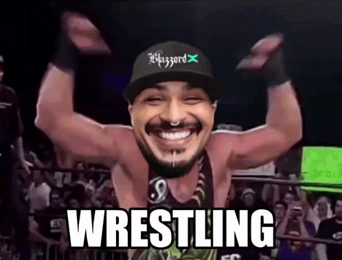 a man wearing a hat with the word blizzard on it is smiling with the word wrestling below him