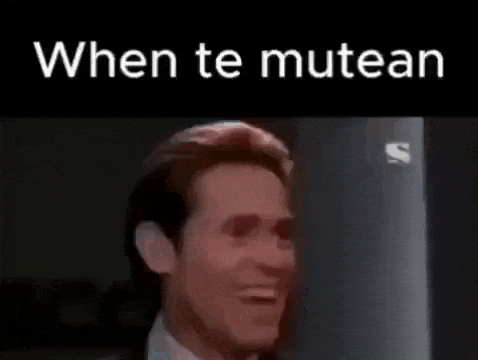 a man in a suit and tie is looking at the camera with the words `` when te mutean '' written above him .
