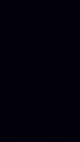 a starry night sky with lots of blue stars on a black background