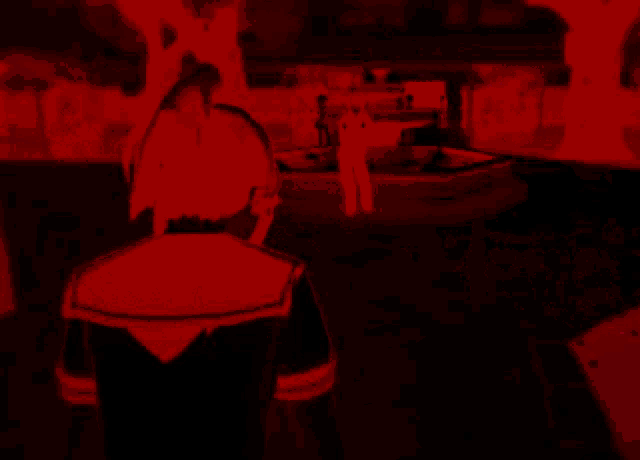 a silhouette of a person in a dark room with a red light behind them