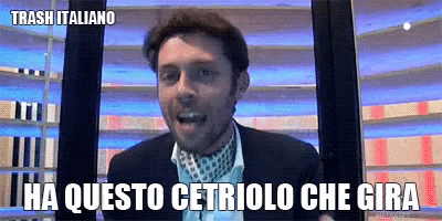 a man in a suit and tie says " ha questo cetriolo che gira "