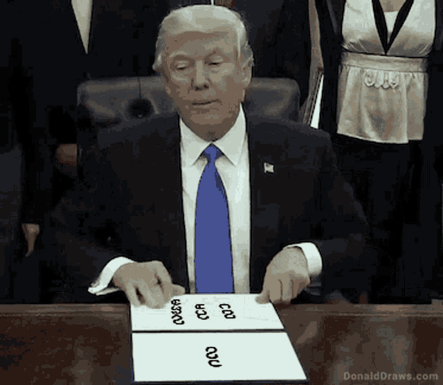 donald trump is sitting at a desk with a piece of paper that says donalddraws.com
