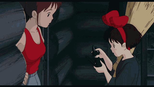 a girl in a red tank top is standing next to a girl in a red headband
