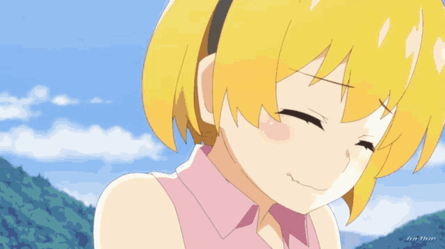 a girl with yellow hair and a pink shirt is smiling with her eyes closed